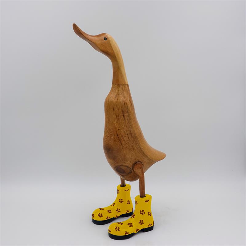 Canard « Dörte » grand brun dressé avec des chaussures à fleurs jaunes