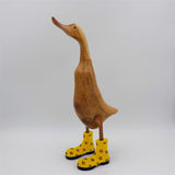 Canard « Dörte » grand brun dressé avec des chaussures à fleurs jaunes