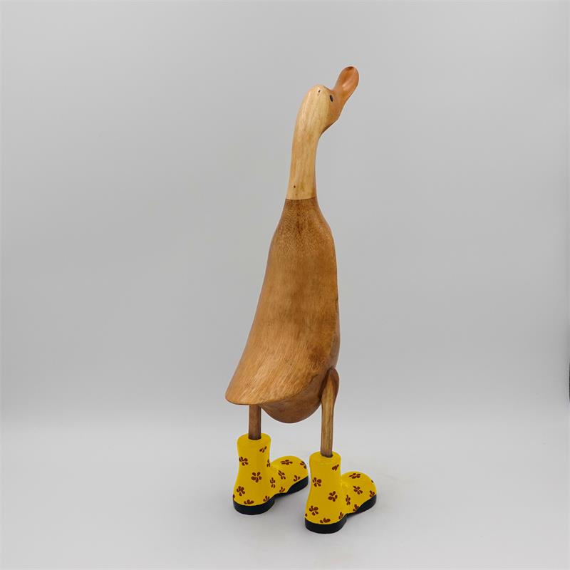 Canard « Dörte » grand brun dressé avec des chaussures à fleurs jaunes