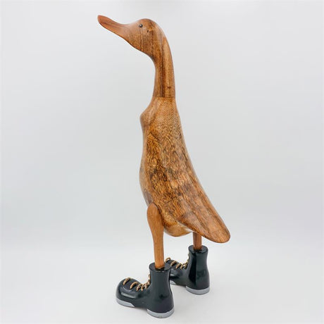 Canard géant « Wolfram » beige-brun dressé avec des chaussures noires/argentées