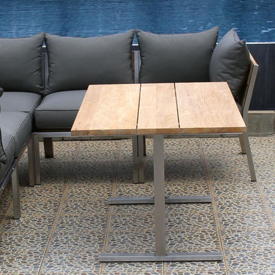 Ensemble de salle à manger et de salon Makan composé de : 1 table de salle à manger et de salon Planka 120 x 80 cm, 3 modules d'angle Makan Lounge, 2 modules centraux Makan Lounge avec coussins d'assise et de dossier en tissu Sunproof